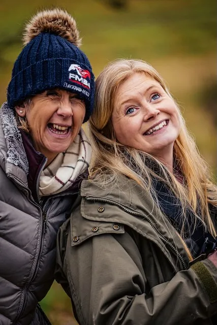 Two ladies and friends smiling