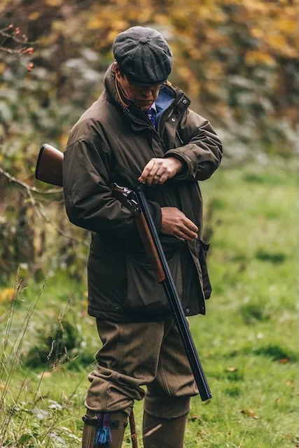 A man loading a shotgun for game shooting